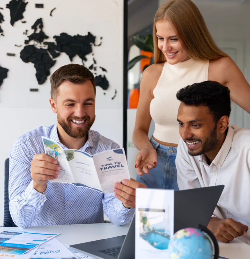 People reviewing travel documents in office with consultant